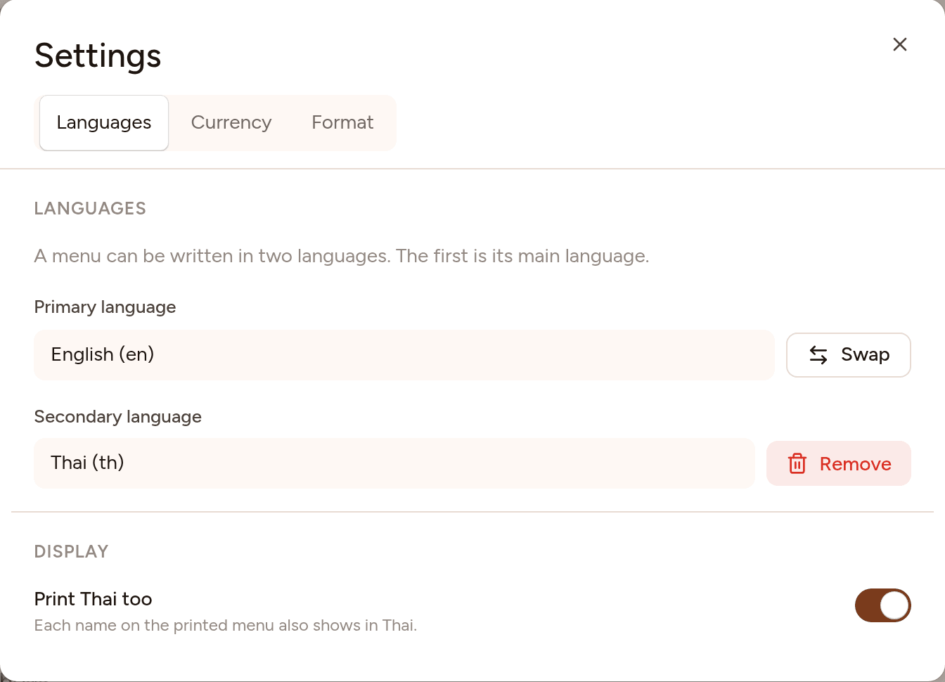 Settings, on the Languages tab: English is the primary language and Thai the secondary, with Swap and Remove buttons, and a switch to print Thai too.